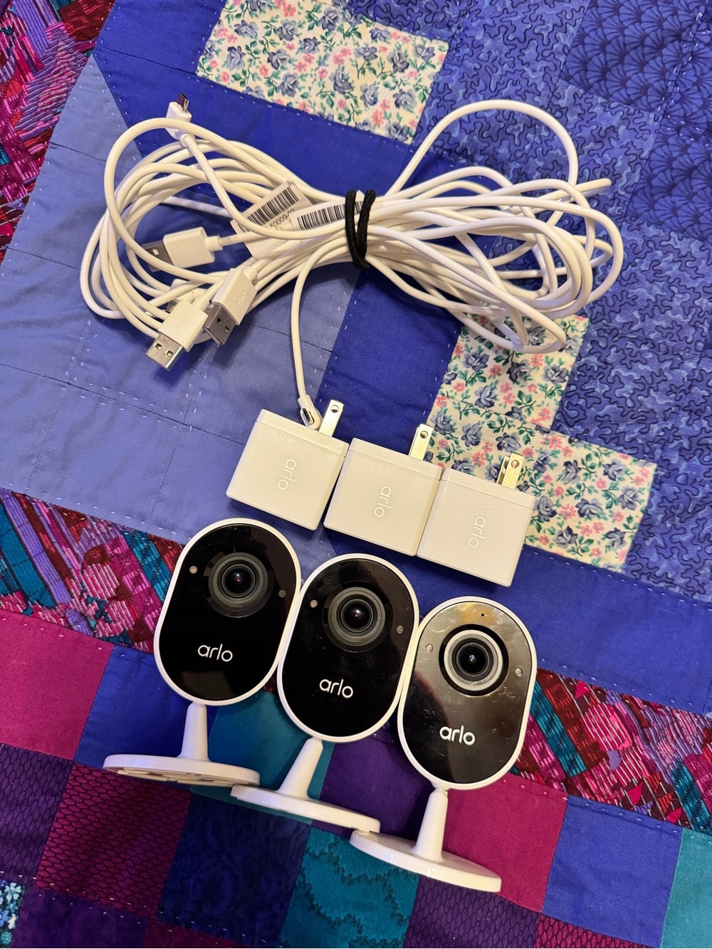 Arlo White Security Camera 3-Pack with Chargers Indoors